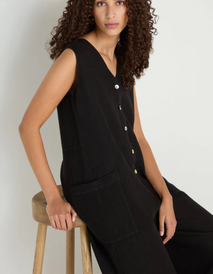woman wearing loose fit black linen jumpsuit