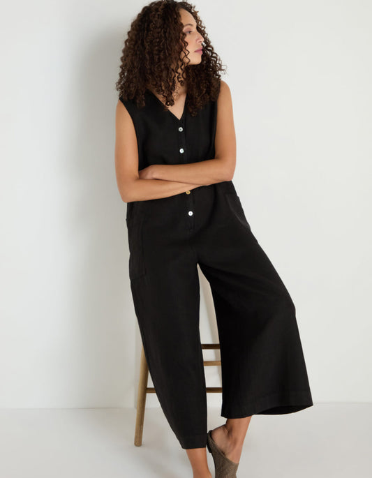 woman wearing loose fit black linen jumpsuit