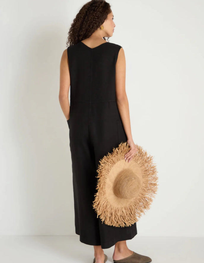 woman wearing loose fit black linen jumpsuit