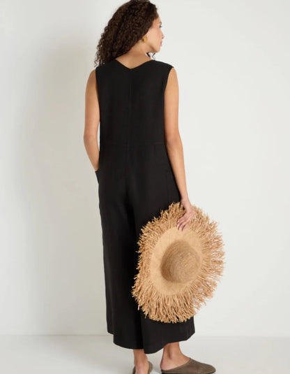 woman wearing loose fit black linen jumpsuit