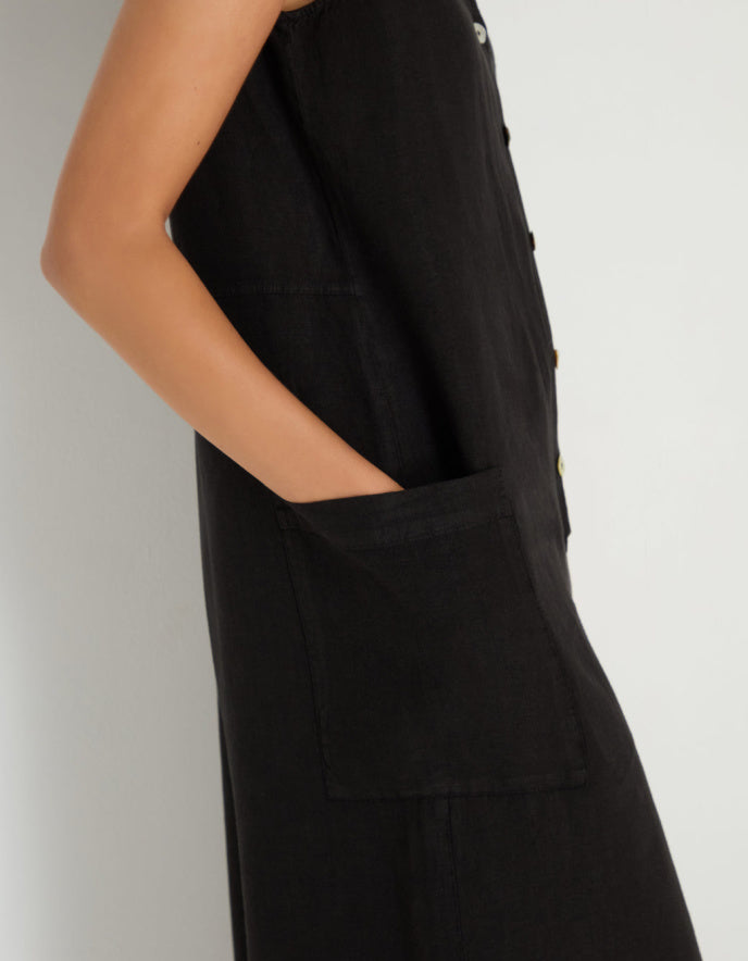 woman wearing loose fit black linen jumpsuit