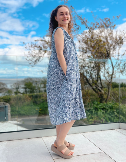 swing shape midi cotton summer dress with crinkle tie effect, white and blue leaf print and V neckline with pleated bodice