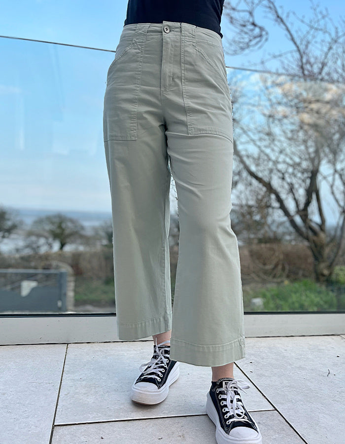 summer cotton twill culotte trousers with a wide leg and front and rear pockets in summer green