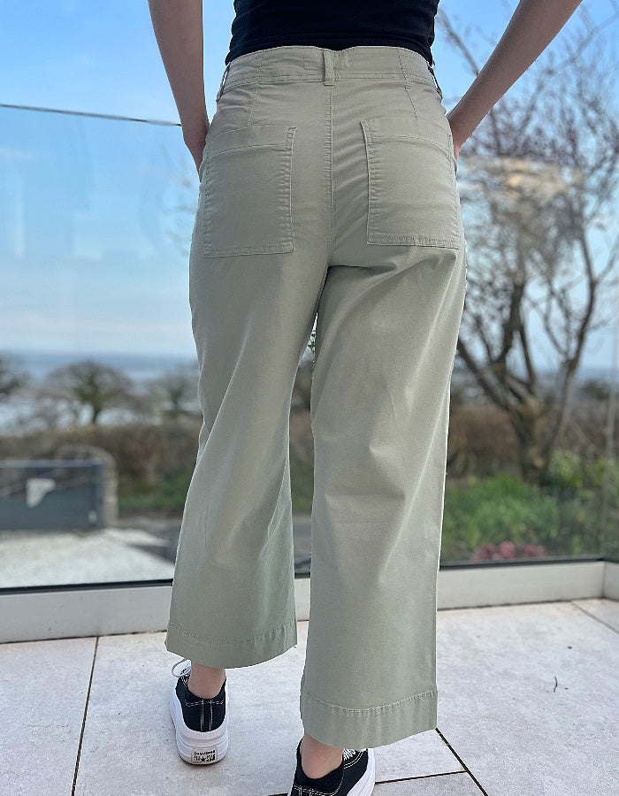 summer cotton twill culotte trousers with a wide leg and front and rear pockets in summer green