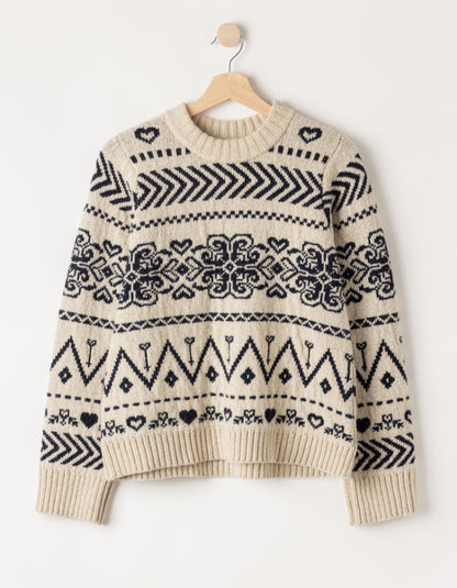  a cream Fairisle patterned scandi sweater on a white background