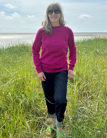 cashmere blend sweater in magenta with cable stitch design in the yoke