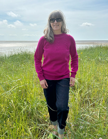 cashmere blend sweater in magenta with cable stitch design in the yoke