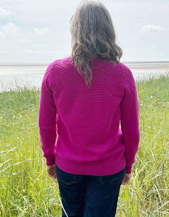 cashmere blend sweater in magenta with cable stitch design in the yoke