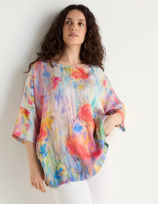 woman wearing floral print boxy tunic top