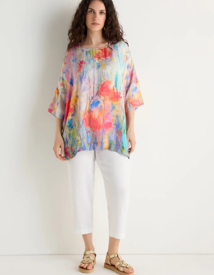 woman wearing floral print boxy tunic top