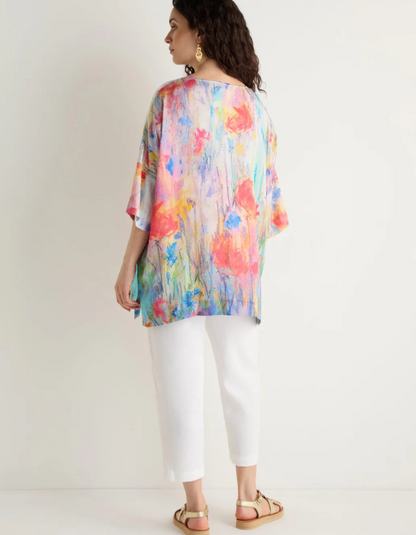 woman wearing floral print boxy tunic top