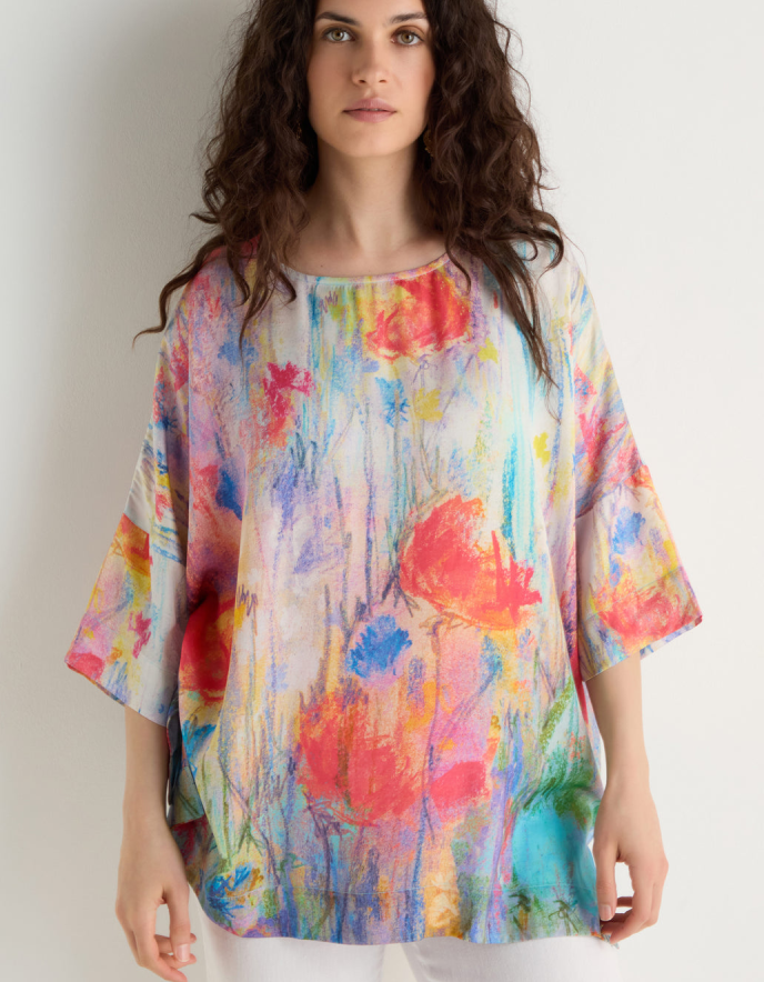 woman wearing floral print boxy tunic top