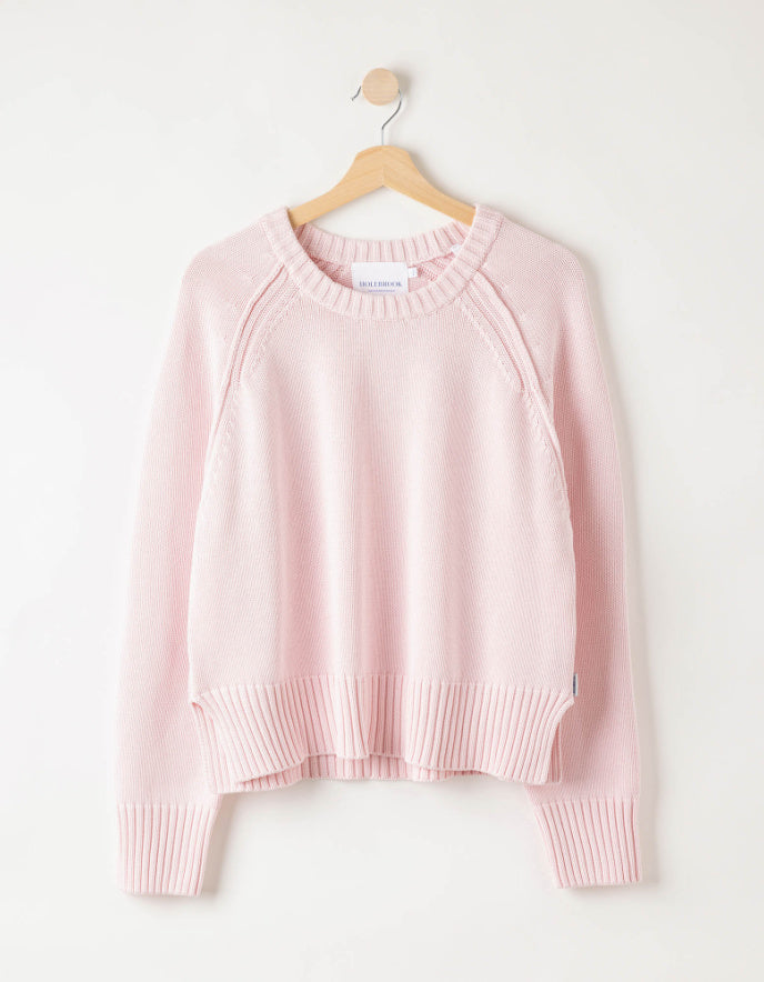 woman wearing pale [pink cotton jumper