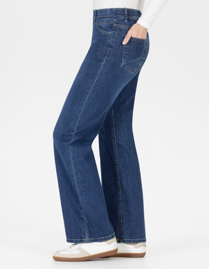 Blue straight leg jeans with elasticated waist worn by a person on a white background