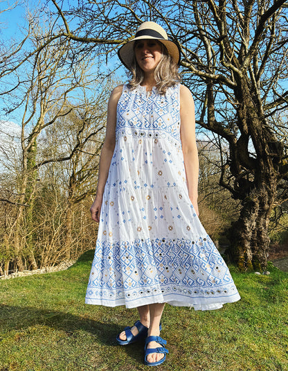 white cotton sleeveless midi dress with blue and gold geo print design and small mirrored details