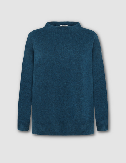 Blue sweater on a light gray background