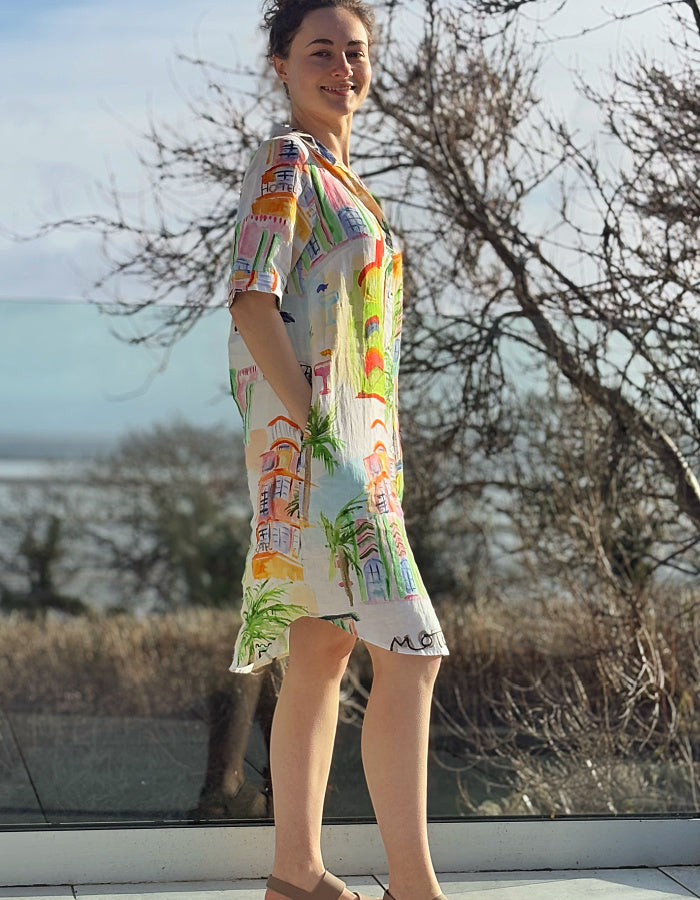 white linen shirt dress with colourful sketch print of tropical Palm trees