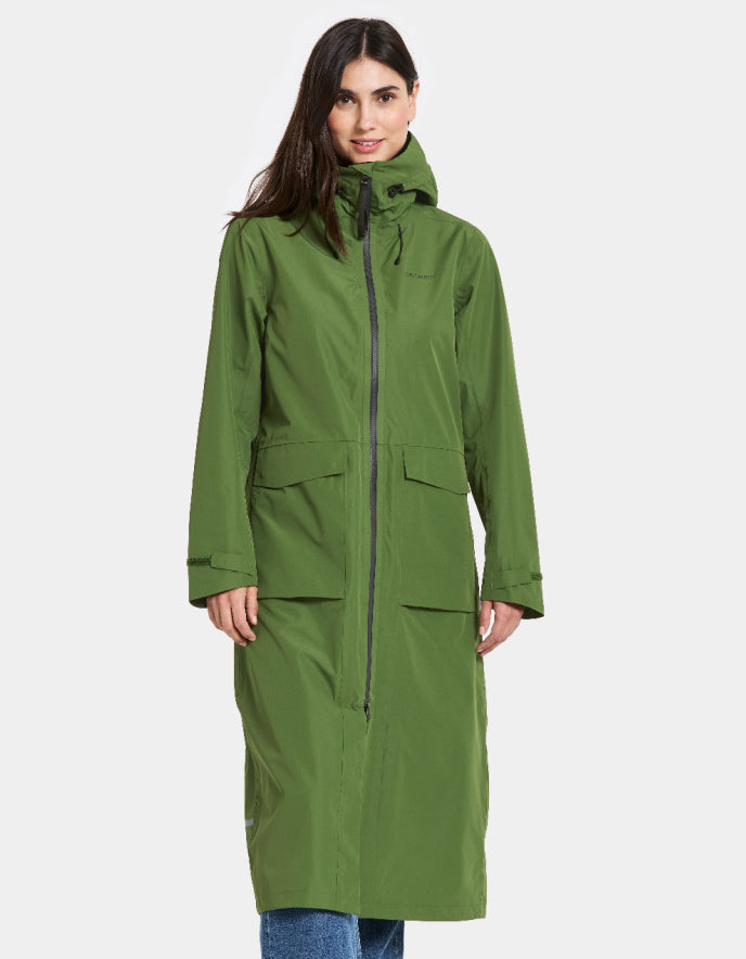 woman wearing midi length green raincoat
