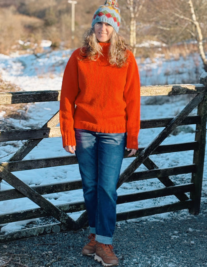 electric orange lambswool polo neck sweater with ribbed hem cuffs and neckline