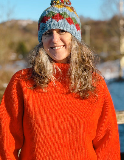 electric orange lambswool polo neck sweater with ribbed hem cuffs and neckline