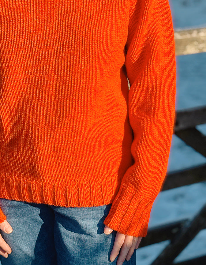 electric orange lambswool polo neck sweater with ribbed hem cuffs and neckline