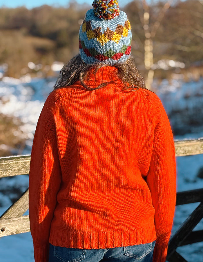 electric orange lambswool polo neck sweater with ribbed hem cuffs and neckline