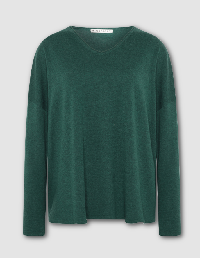 Green sweater on a light gray background