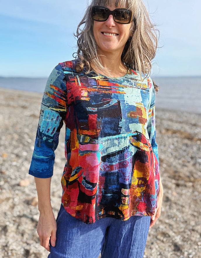 woman wearing a colourful t shirt with boat print