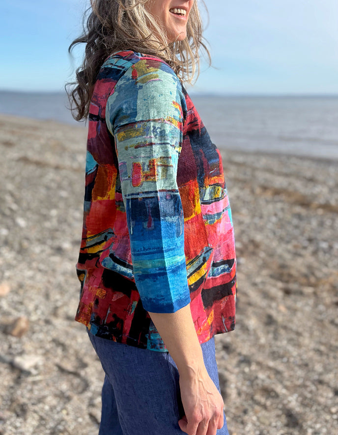 woman wearing a colourful t shirt with boat print
