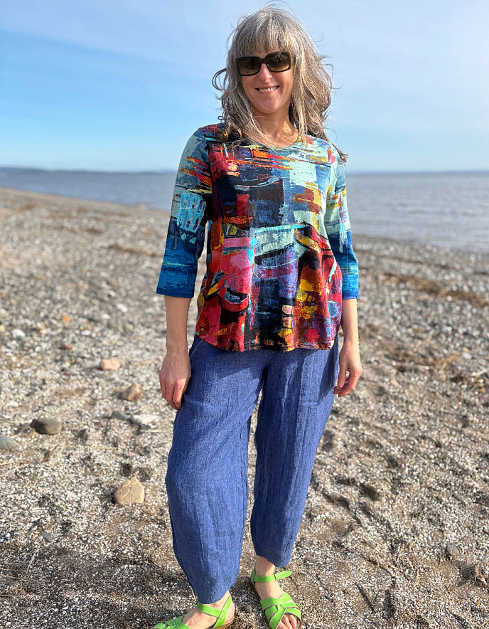 woman wearing a colourful t shirt with boat print