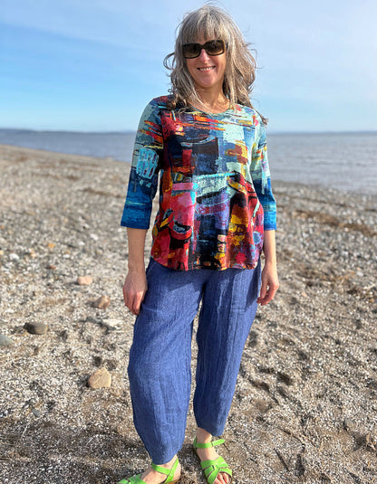 woman wearing a colourful t shirt with boat print