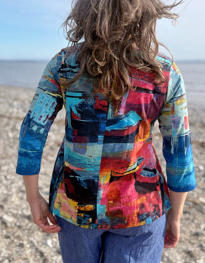 woman wearing a colourful t shirt with boat print
