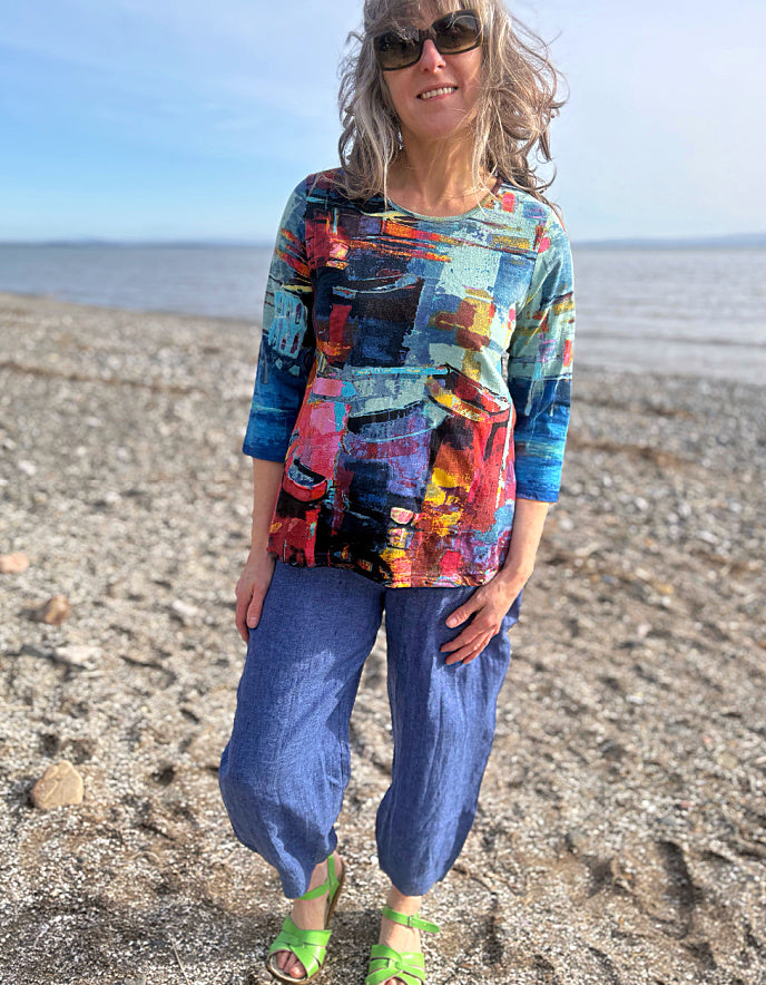 woman wearing a colourful t shirt with boat print