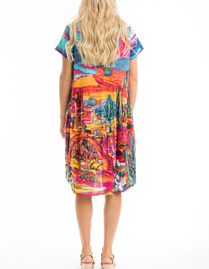 knee length loose fit cotton sun dress with capped sleeves and empire line was it in bright coloured Mexican themed print