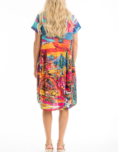 knee length loose fit cotton sun dress with capped sleeves and empire line was it in bright coloured Mexican themed print