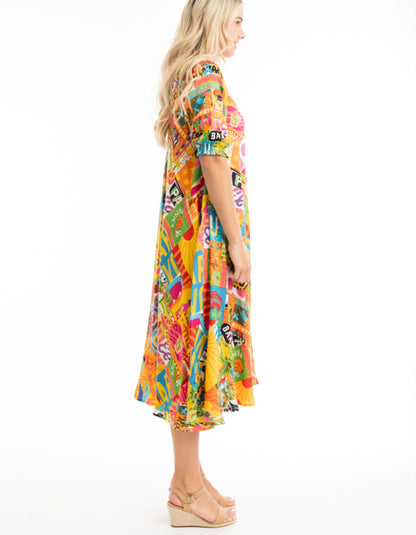 mexican themed printed swing dress, below the knee length with elbow length sleeves in bright colourful shades, yellow pink green and blue. very fun