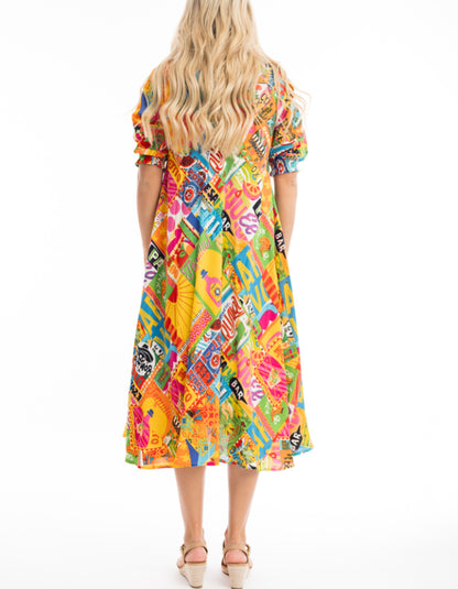 mexican themed printed swing dress, below the knee length with elbow length sleeves in bright colourful shades, yellow pink green and blue. very fun