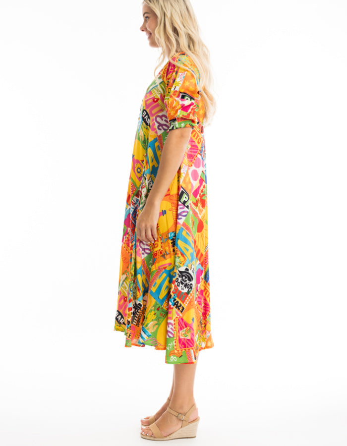 mexican themed printed swing dress, below the knee length with elbow length sleeves in bright colourful shades, yellow pink green and blue. very fun