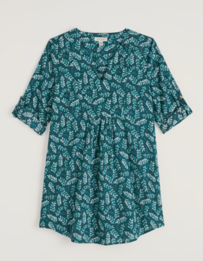 Green patterned dress on a light gray background