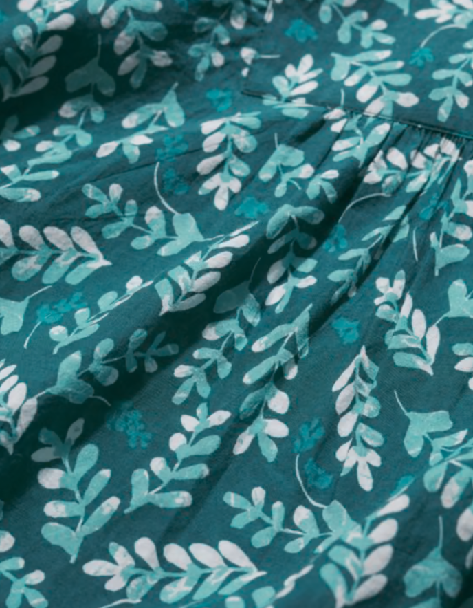 Teal fabric with light blue leaf pattern