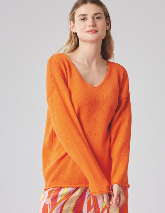 soft orange cotton sweater with V neckline straight fit and rolled edges