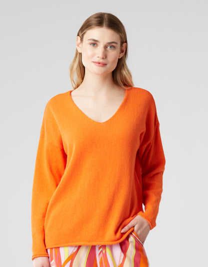 soft orange cotton sweater with V neckline straight fit and rolled edges