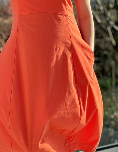 stretchy trapeze midi length bubble dress with v neckline and sleeveless design in stunning coral orange colour
