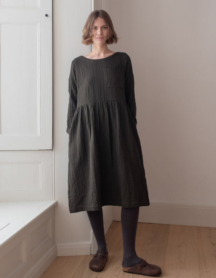 loose fit flared midi length dress with pockets in cotton olive mini check plaid design