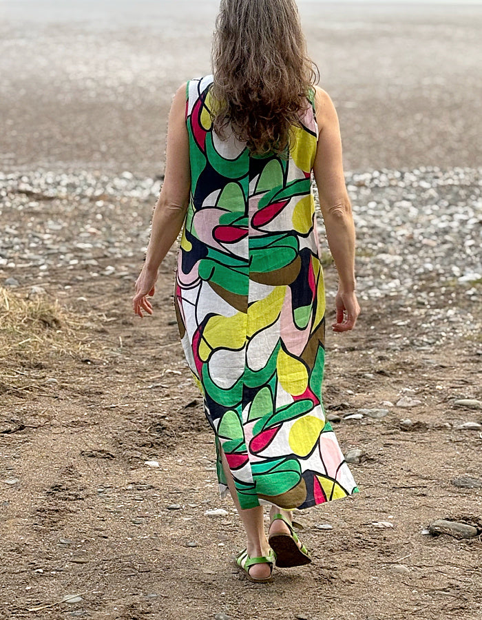 midi length linen dress with square neckline, sleeveless with pockets in abstract print in green pink yellow and navy