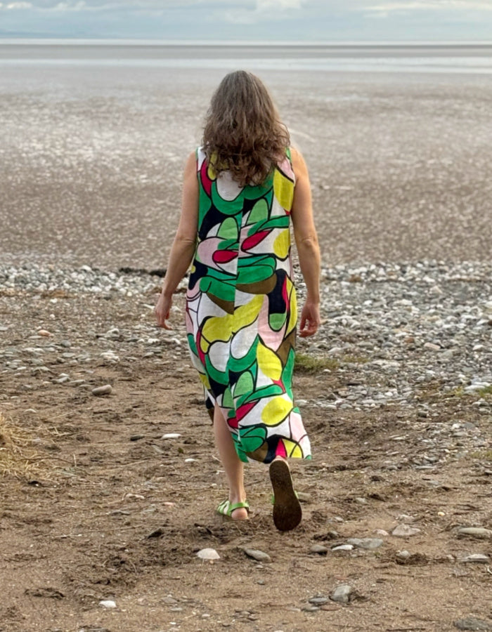 midi length linen dress with square neckline, sleeveless with pockets in abstract print in green pink yellow and navy