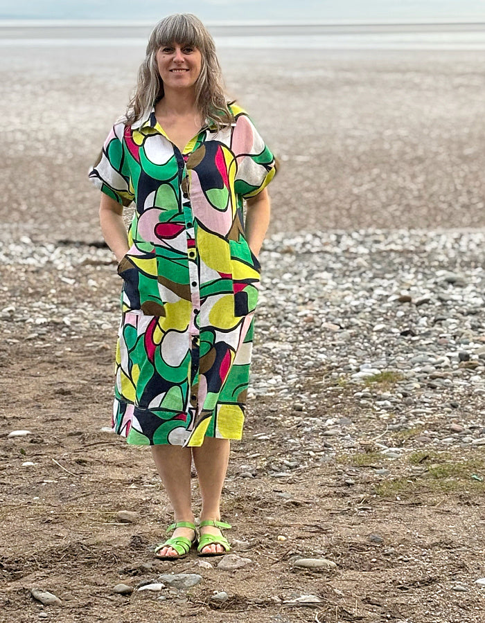 midi length linen shirt dress with pockets in abstract print in green pink yellow and navy