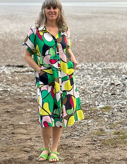 midi length linen shirt dress with pockets in abstract print in green pink yellow and navy