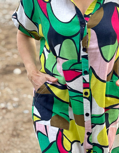 midi length linen shirt dress with pockets in abstract print in green pink yellow and navy