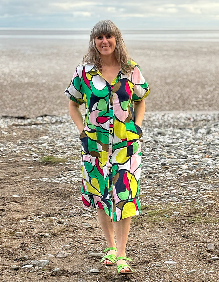 midi length linen shirt dress with pockets in abstract print in green pink yellow and navy